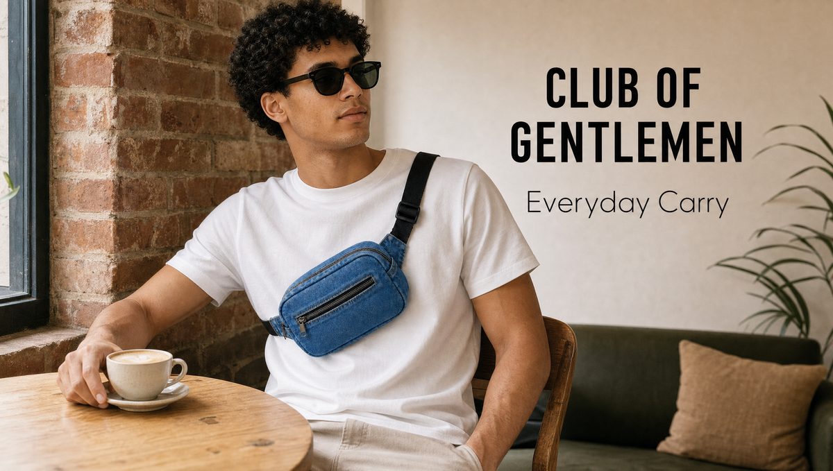 Man wearing a denim belt bag over a white t-shirt at a café table, text overlay "Club of Gentlemen, Everyday Carry"